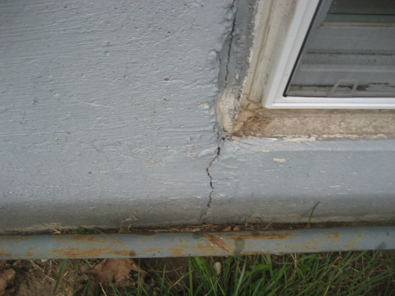 Basement Window Crack in Foundation.JPG
